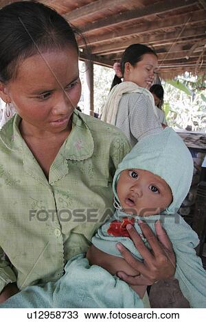 Stock Image - person, baby, child, hand, people, woman. Fotosearch