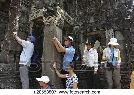 Stock Photo - photographs, person, taking, tourists, cambodia, people. Fotosearch