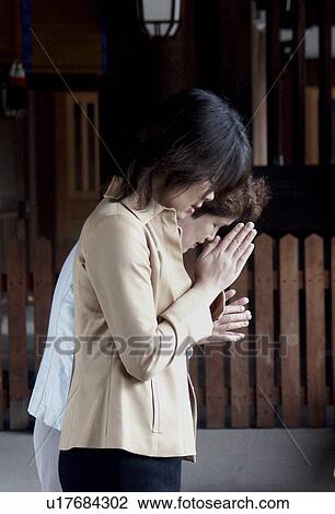 Stock Image - praying, people, japan, women, person, love. Fotosearch