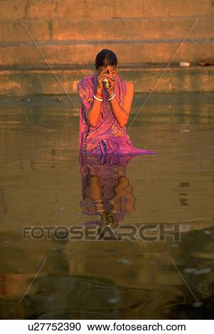 Stock Image - praying, water, female, people, love, woman. Fotosearch