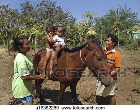 Stock Photo - riding, horse, nicaragua, children, person, people. Fotosearch