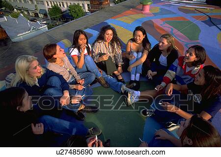 Stock Image - rooftop, school, girls, teenage, meeting, people. Fotosearch