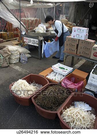 Stock Photograph - sale, people, mushrooms, korea, person, food. Fotosearch