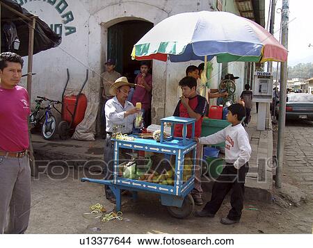 Picture - seller, fruit, drink, guatemala, person, people. Fotosearch