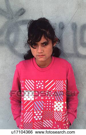 Stock Photograph - solemn, released, girl, hispanic, mexican, model. Fotosearch