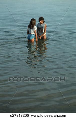 talk, water, girl, talking, playing, girls View Large Photo Image Stock Photography - talk, water, girl, talking, playing, girls. Fotosearch