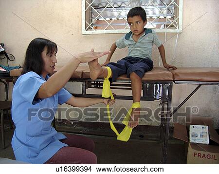 Picture - treating, hand, physiotherapist, salvador, person, people. Fotosearch