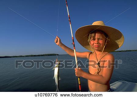 up, fish, holding, boy, sun, water View Large Photo Image Stock Photograph - up, fish, holding, boy, sun, water. Fotosearch