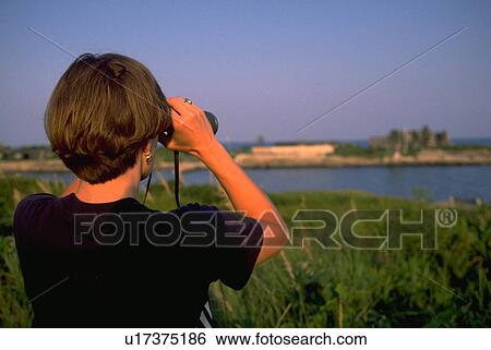Stock Photograph - view, summer, binoculars, female, home, woman. Fotosearch