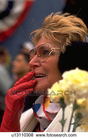 Stock Photo - welcome, woman, home, people, flowers, family. Fotosearch