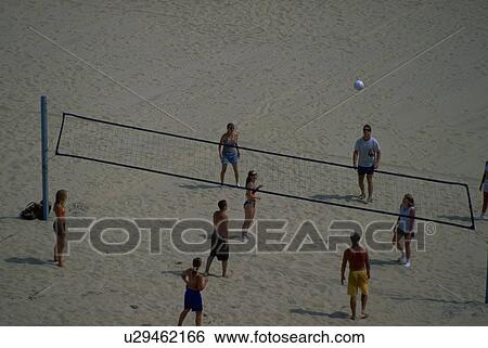 Stock Photograph - ball, tourists, volley, play, frequently, happy. Fotosearch