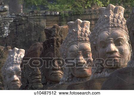 Stock Image - bayon, buddhas, thom, angkor, row, carved. Fotosearch