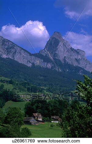 Stock Photo - blue, fields, houses, wooden, swiss, green. Fotosearch