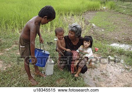 carried, people, boy, cambodia, person, water View Large Photo Image Stock Photography - carried, people, boy, cambodia, person, water. Fotosearch