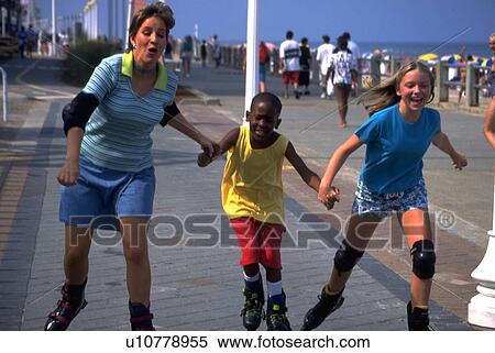 Stock Photography - children, woman, two, rollerblades, female, young. Fotosearch