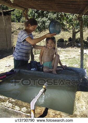 Stock Image - daughter, people, giving, honduras, person, woman. Fotosearch