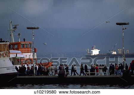 Stock Image - dock, embarking, portugal, lisbon, boat, people. Fotosearch