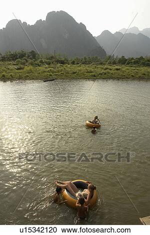 Stock Image - down, person, tubing, tourists, laos, people. Fotosearch