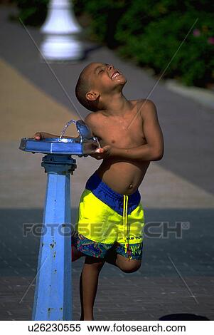 drink, happy, getting, black, boy, young View Large Photo Image Stock Photography - drink, happy, getting, black, boy, young. Fotosearch