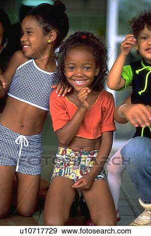 Stock Photo - enjoying, children, kids, friendly, kid, child. Fotosearch