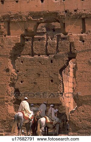 Stock Image - entering, moroccan, horseback, males, men, people. Fotosearch