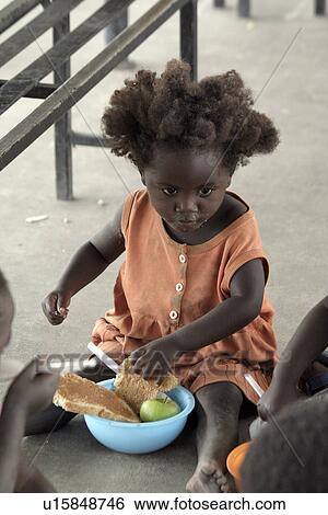 Stock Photograph - feeding, people, namibia, children, person, food. Fotosearch