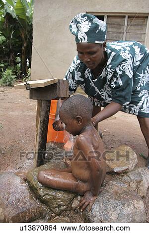 Picture - female, baby, tanzania, person, people, woman. Fotosearch