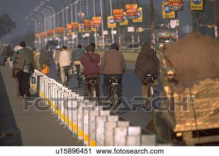 Stock Image - festival, concrete, kumbhmela, 2001, bridge, bicyclists. Fotosearch
