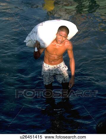 Stock Photography - filipino, heavy, carries, male, water. Fotosearch