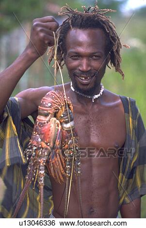 Stock Photograph - fish, male, jamaican, hand. Fotosearch