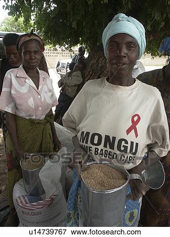 Stock Photo - grain, food, person, hand, people, woman. Fotosearch