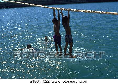 hanging, sport, playing, kids, children, water View Large Photo Image Stock Image - hanging, sport, playing, kids, children, water. Fotosearch