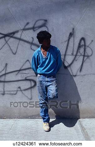 Stock Image - hispanic, leaning, male, portrait. Fotosearch