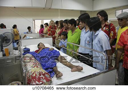 Stock Photography - hospice, person, aids, visitors, thailand, people. Fotosearch