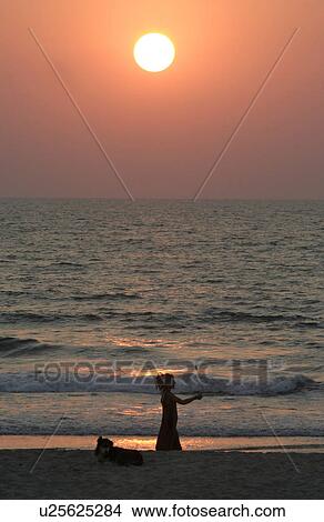 Picture - india, people, sun, person, sport, beach. Fotosearch
