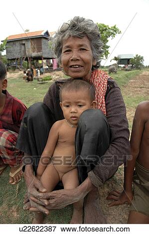 Stock Photo - kampong, people, grandchild, cambodia, person, woman. Fotosearch