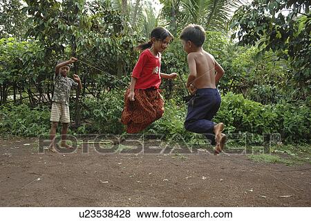 Stock Photo - kampong, person, skipping, cambodia, children, people. Fotosearch