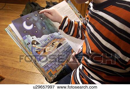 Stock Photo - kid, kids, child, book, reading, children. Fotosearch