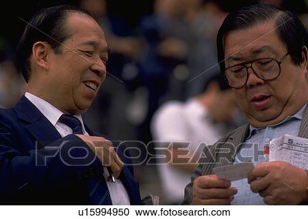 Stock Image - kong, people, hong, negotiating, businessmen, business. Fotosearch
