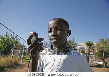 Picture - listening, people, boy, namibia, person, music. Fotosearch