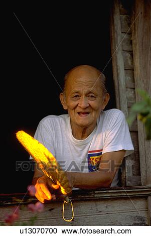 Stock Image - male, window, out, looks, old. Fotosearch