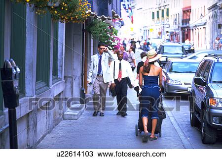 Stock Image - mother, leered, stroller, walking, woman. Fotosearch