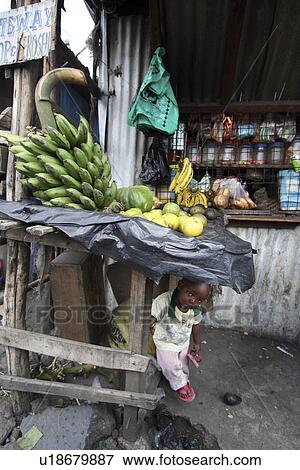 Stock Photo - mukuru, person, shops, small, kenya, people. Fotosearch
