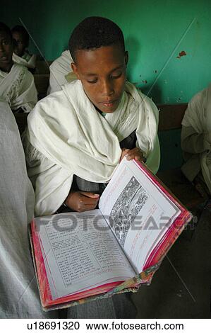 Stock Image - orphan, people, ethiopia, book, person, background. Fotosearch