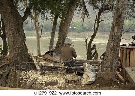 Stock Image - person, mekong, working, laos, people. Fotosearch