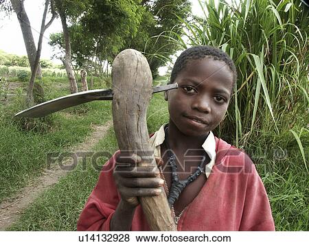 Stock Photo - person, zambia, hoe, boy, people. Fotosearch