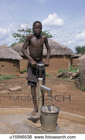 Stock Photo - pumping, people, boy, ghana, person, water. Fotosearch