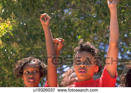 Stock Photo - raised, girl, girls, children, sport, people. Fotosearch
