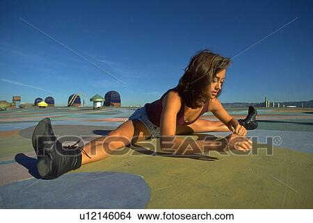 Picture - rooftop, woman, stretch, california, female, alameda. Fotosearch
