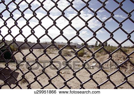 Stock Photograph - running, border, fence, usa, person, people. Fotosearch